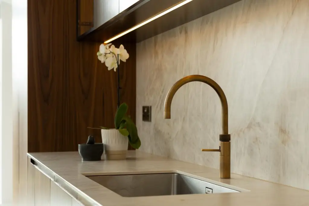Blanco Andano sink with brushed brass Quooker tap in a contemporary walnut kitchen